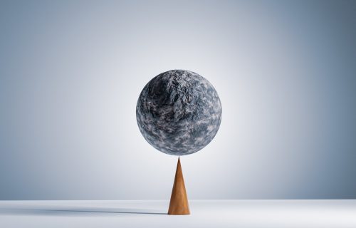 computer generated image of a stone sphere balancing perfectly on the tip of a wooden cone.