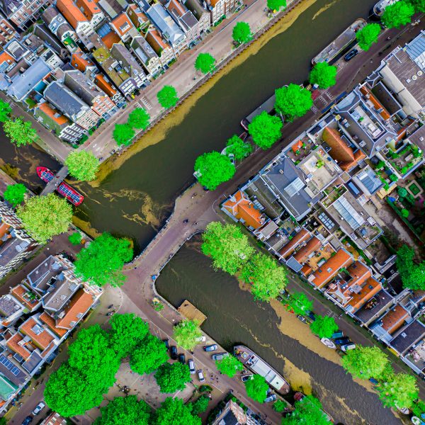 Aerial drone top down photo of Amsterdam canals with leisure boa