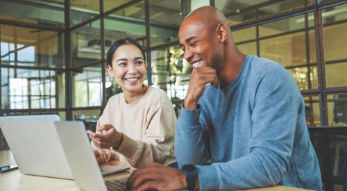 People working together with laptops