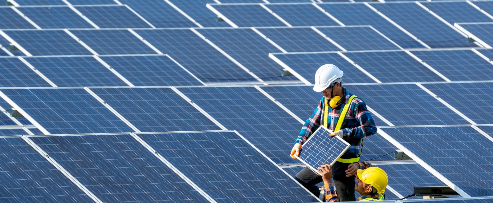 Team electrician installing solar panels working on alternative energy sources clean.