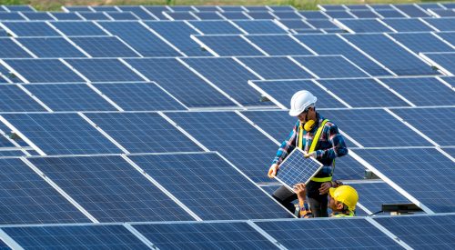 Team electrician installing solar panels working on alternative energy sources clean.