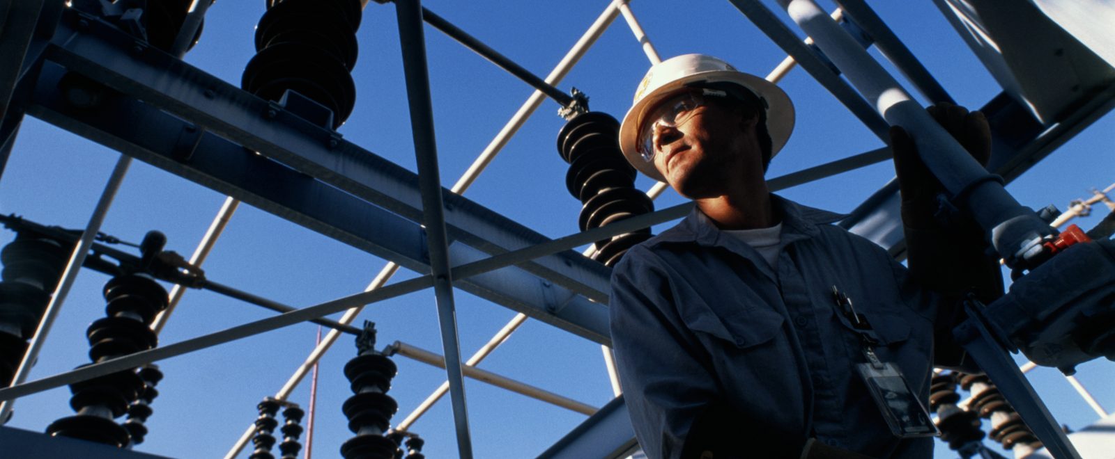 Engineer at work in electricity substation