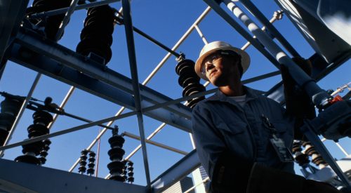 Engineer at work in electricity substation