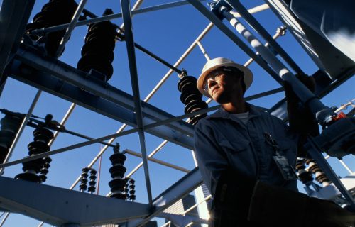 Engineer at work in electricity substation
