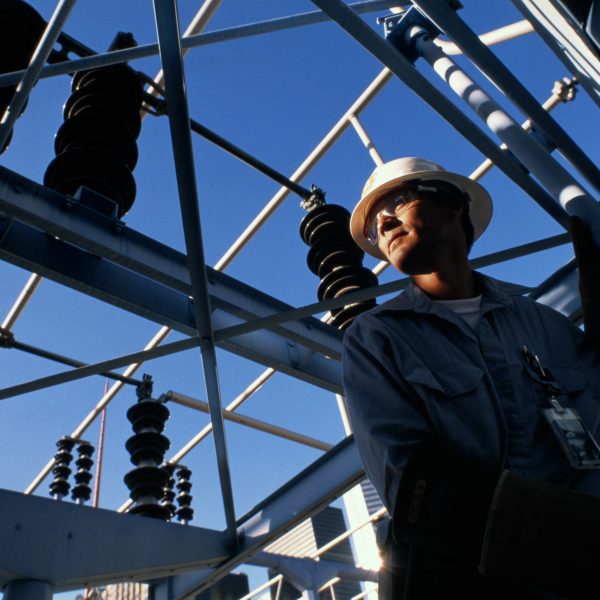 Engineer at work in electricity substation
