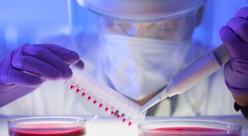 Close-up of scientist in protective clothing