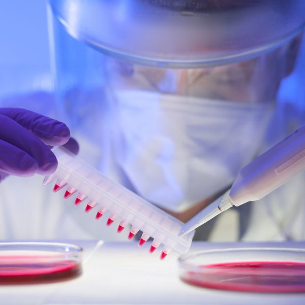 Close-up of scientist in protective clothing