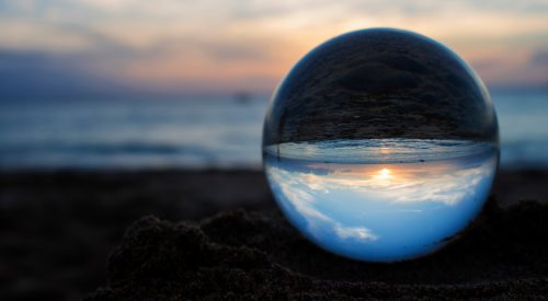 Sunset Captured in Glass or Crystal Ball on Beach