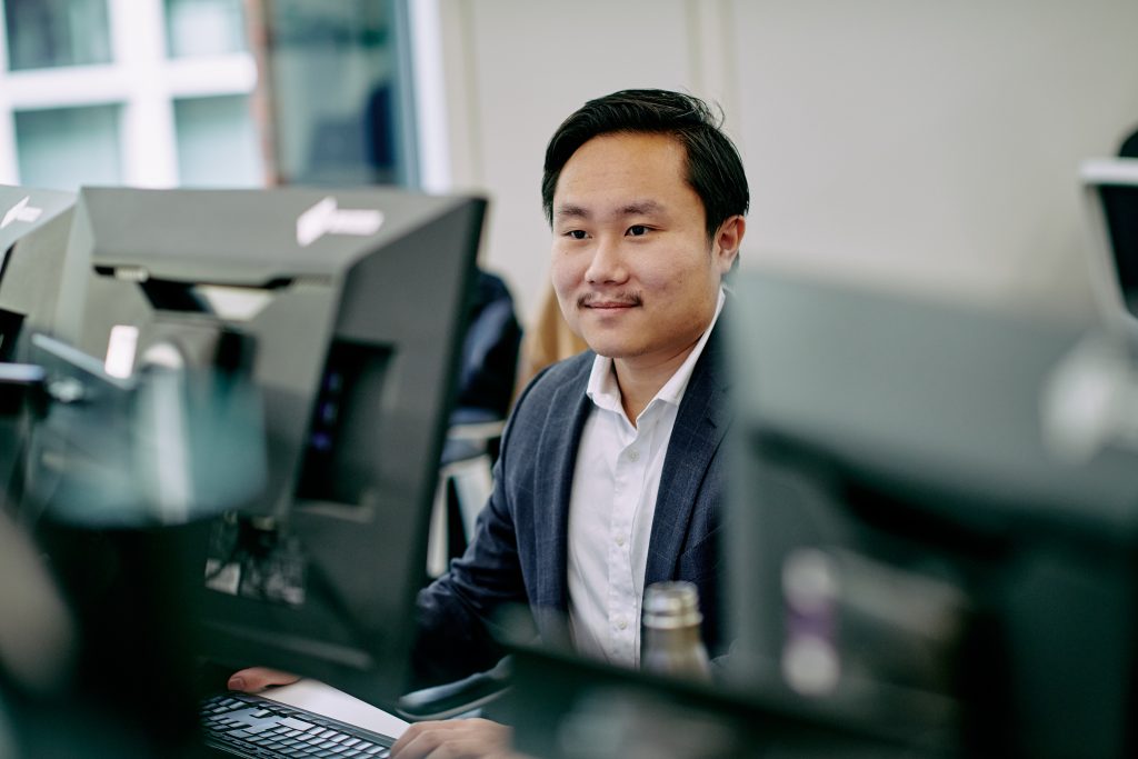 ICG employee at his desk