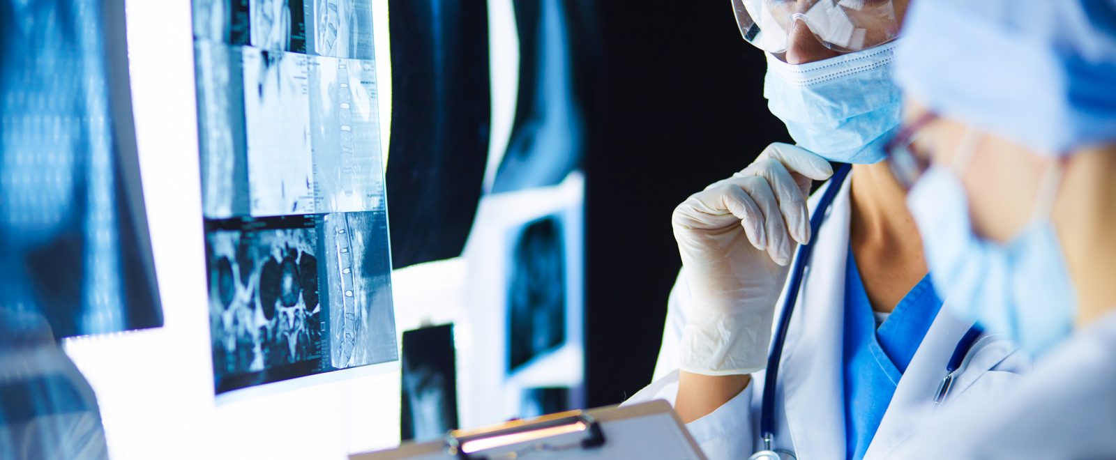 Two female women medical doctors looking at x-rays in a hospital