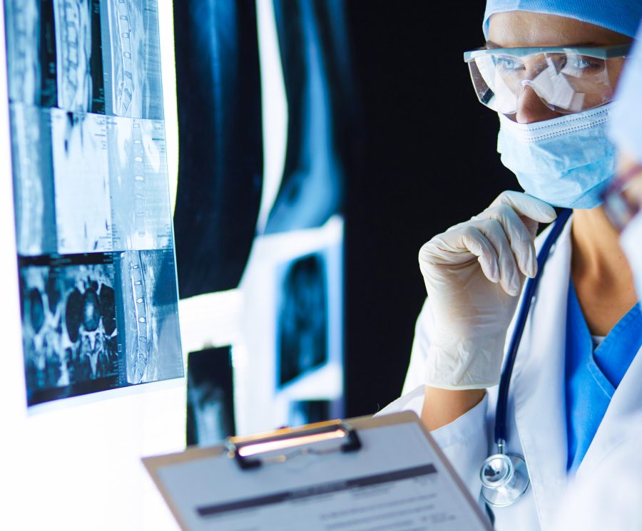 Two female women medical doctors looking at x-rays in a hospital