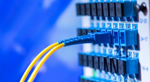 fibre optic cables plugged into communications terminal