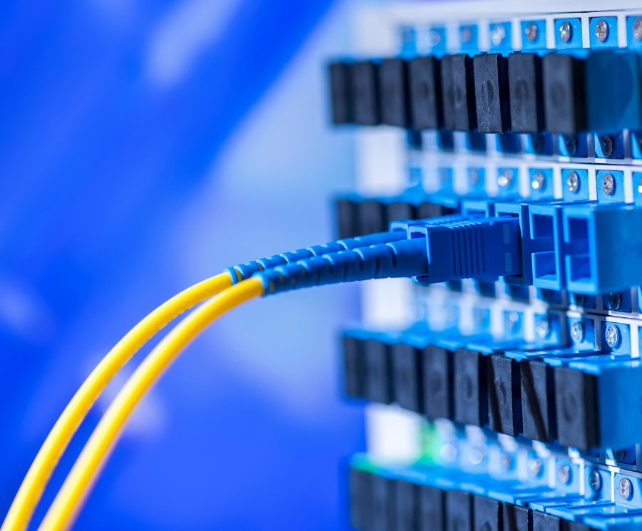 fibre optic cables plugged into communications terminal