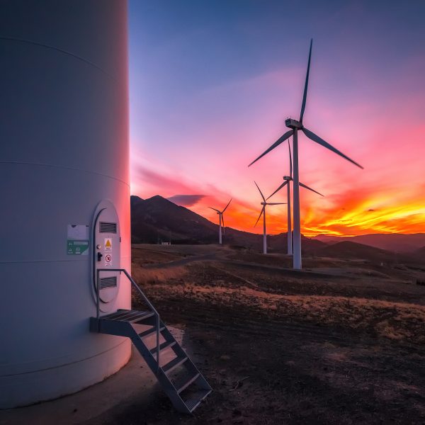 Colorful sunset with wind turbines