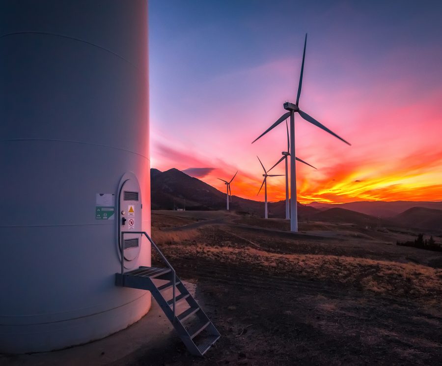 Colorful sunset with wind turbines