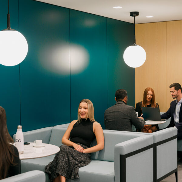 ICG employees in conversation in our Club Room in New York