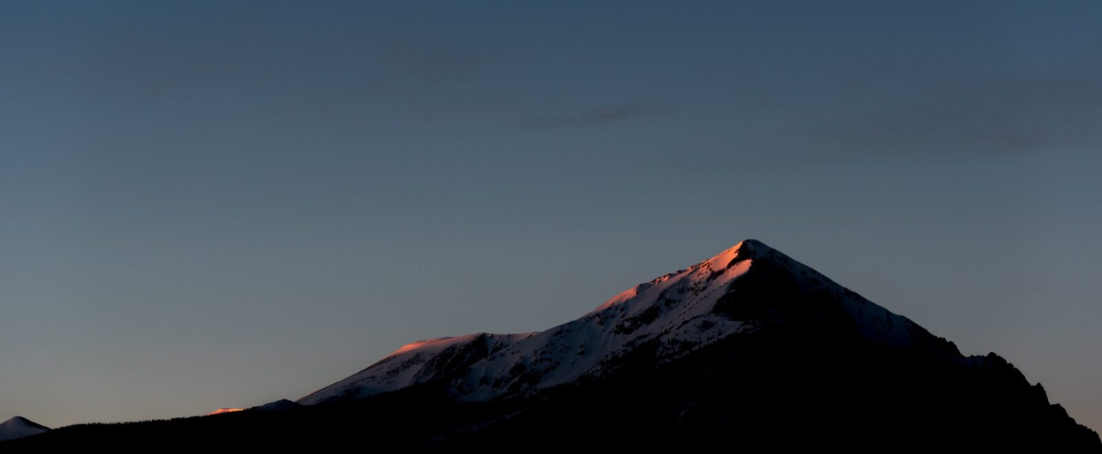 Silverthorne peak at dusk. Photo by Nathan Anderson via Unsplash.