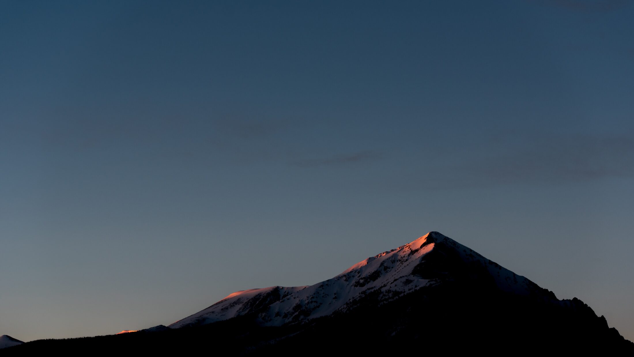 Silverthorne peak at dusk. Photo by Nathan Anderson via Unsplash.