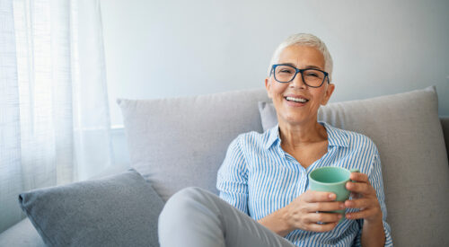 Woman sitting on sofa