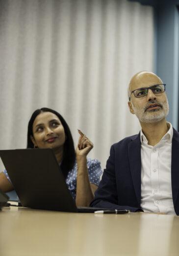 Man and woman in ICG meeting room