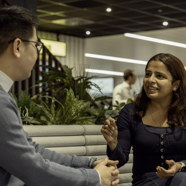 Two colleagues conversing in our London office