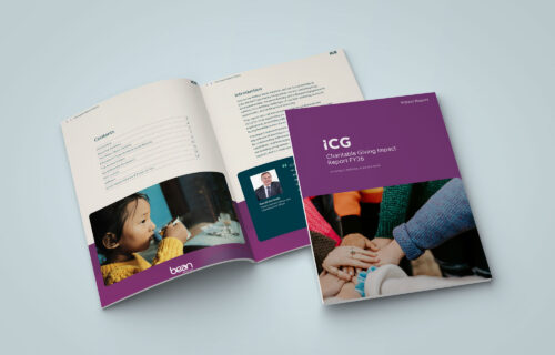 A physical version of the ICG Charitable Giving Impact Report, showing the cover and the first two interior pages with the introduction and executive summary.