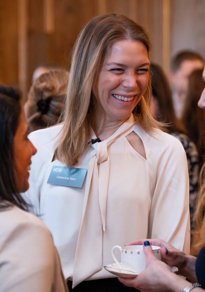 Women talking with colleagues