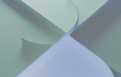Purple and green shapes intersection in an illustration suggestive of progress