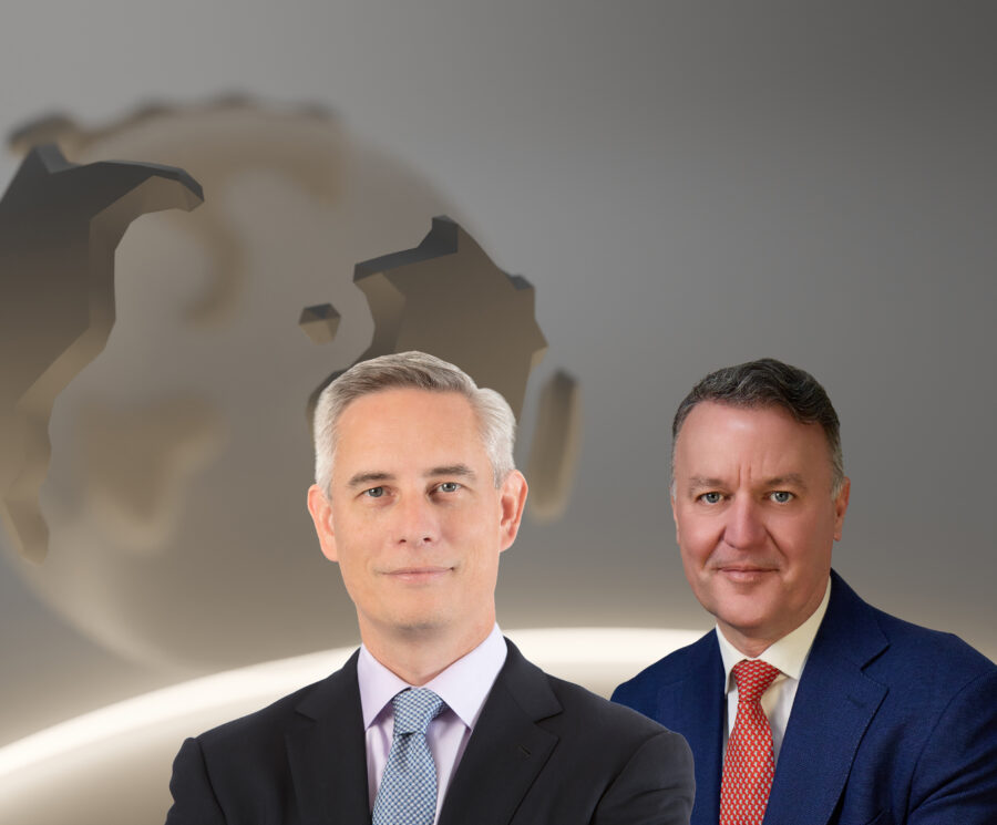 Brian Spenner, Head of North American Credit, ICG, and David Bicarregui, Chief Financial Officer, ICG, in front of an illutration of the Atlantic Ocean seen on a gold globe representing Earth, with a podcast microphone shown on the left-hand-side