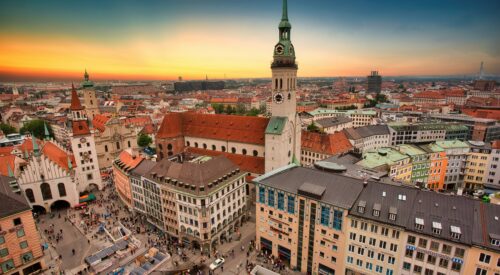 Aerial view of city buildings in Munich during sunset