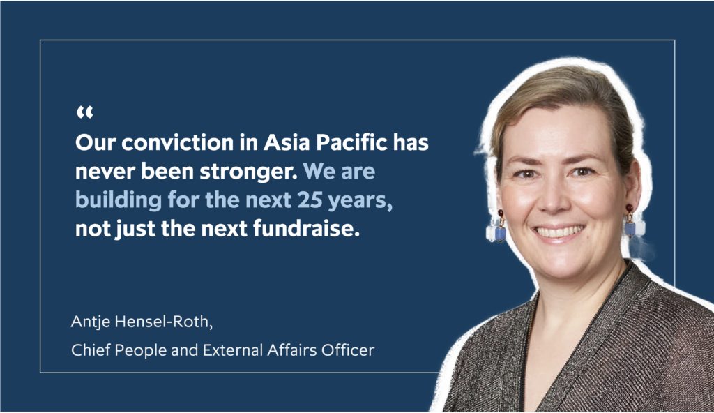 Antje Hensel-Roth, Chief People and External Affairs Officer, wearing a dark blouse and blue earrings, is pictured by a quote from her: "Our conviction in Asia Pacific has never been stronger. We are building for the next 25 years, not just the next fundraise"